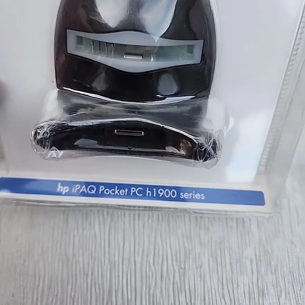 HP iPAQ Pocket PC h1900 series USB dock/charger.